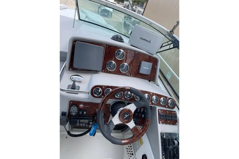 Slide: The Image of Helm of 2004 Formula 34 Performance Cruiser with Garmin navigation system and woodgrain dashboard. - 5