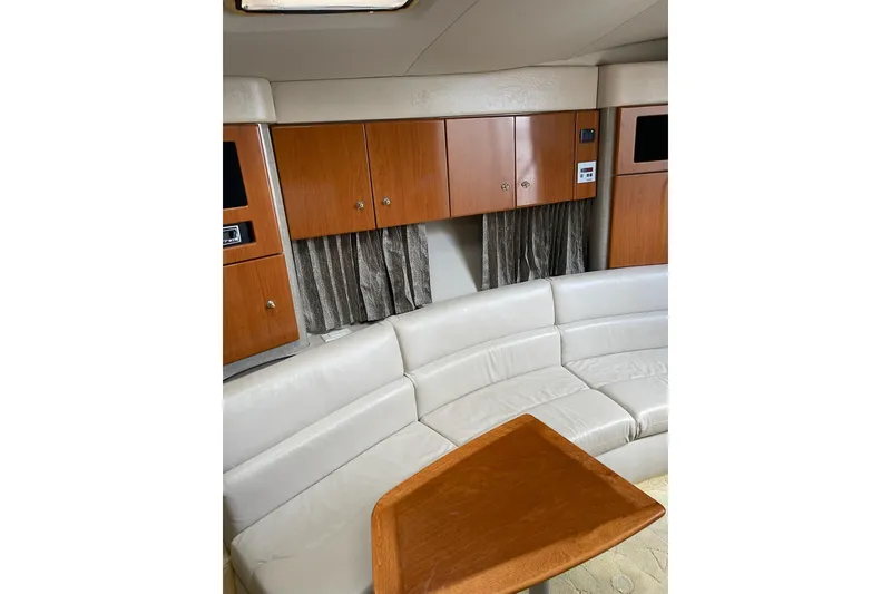 Slide: The Image of Interior of 2004 Formula 34 Performance Cruiser with white leather seating and wooden cabinetry. - 23
