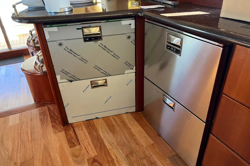 Slide: The Image of Kitchen area of a 2008 Silverton 52 Ovation yacht with stainless steel appliances. - 7