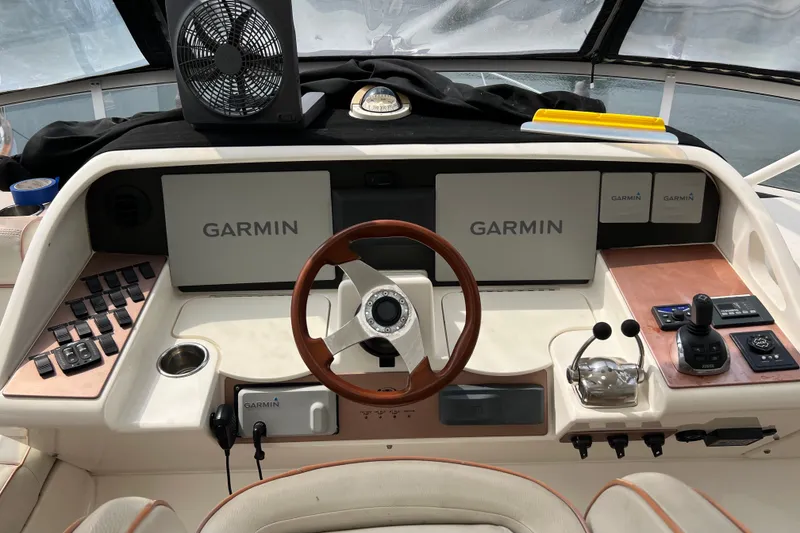 Slide: The Image of Helm of 2008 Silverton 52 Ovation yacht with Garmin navigation displays and controls. - 6