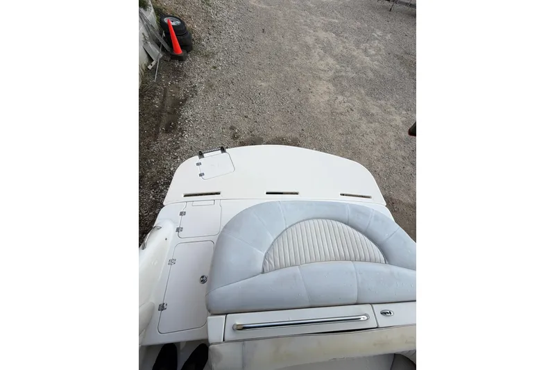 Slide: The Image of 2009 Mastercraft X-45 boat interior with white seating and storage compartments. - 16