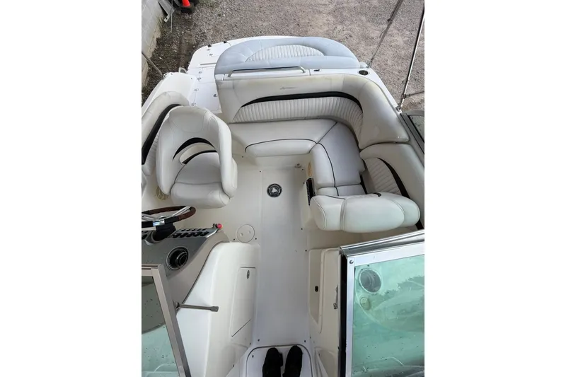 Slide: The Image of 2009 Mastercraft X-45 boat interior with white seating and steering console. - 15