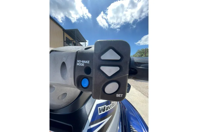 Slide: The Image of Close-up of 2016 Yamaha VX-Deluxe handlebar controls under a clear blue sky. - 7