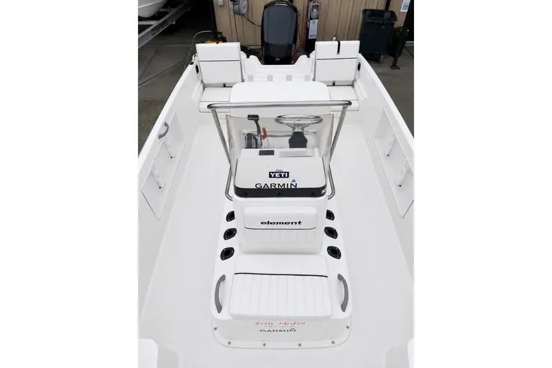 Slide: The Image of 2021 Bayliner Element F21 boat interior with Garmin and Yeti accessories. - 11