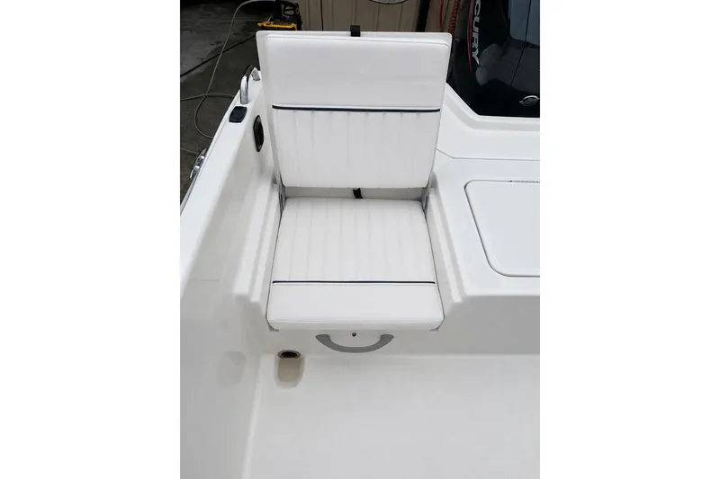 Slide: The Image of 2021 Bayliner Element F21 boat seat with white upholstery and sleek design. - 9