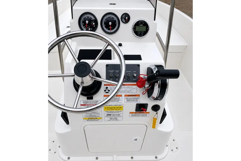 Slide: The Image of 2021 Bayliner Element F21 boat console with steering wheel and control panel. - 7