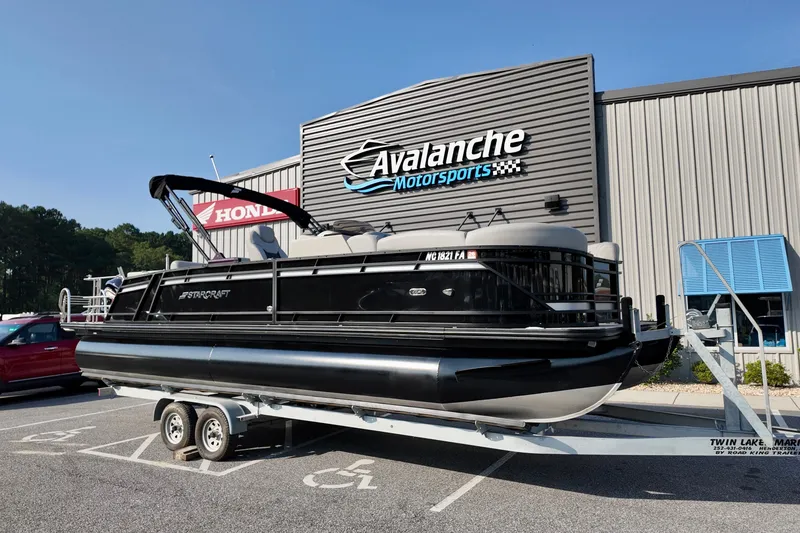 The Image of 2023 Starcraft CX 25 DL pontoon boat on trailer at Avalanche Motorsports. - 0