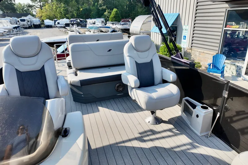 Slide: The Image of 2023 Starcraft CX 25 DL boat interior with plush seating and modern design. - 5