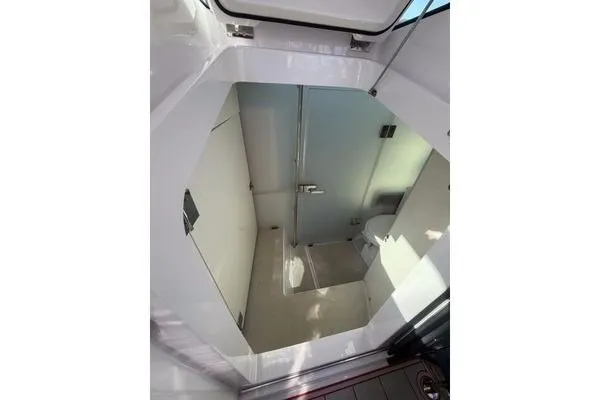 Slide: The Image of 2024 Axopar 37 Sun-Top interior cabin with modern design and sleek finishes. - 7