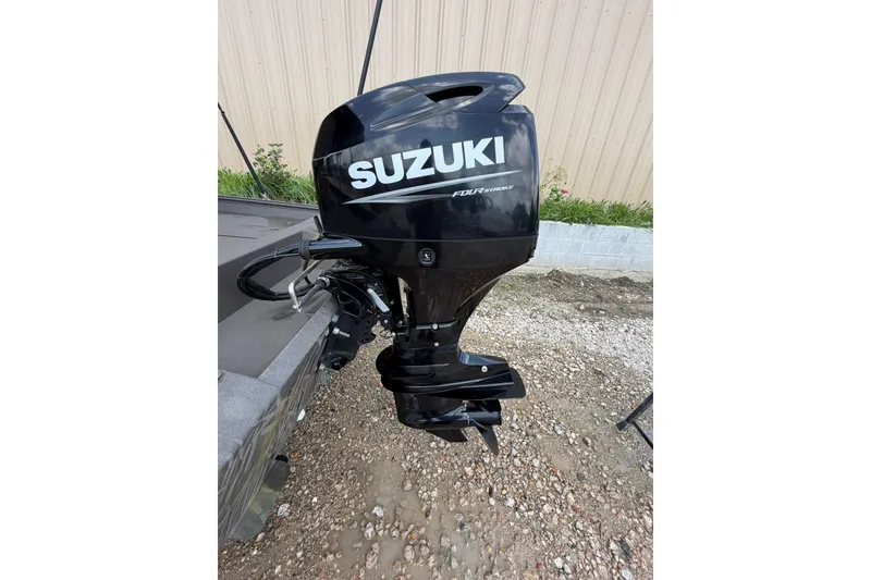 Slide: The Image of 2024 Alweld 1856 Invader boat with Suzuki four-stroke outboard motor. - 17