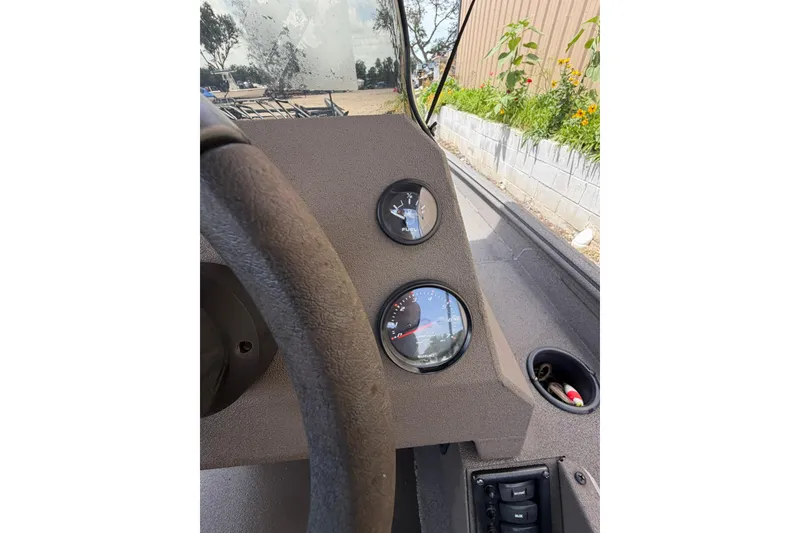Slide: The Image of 2024 Alweld 1856 Invader dashboard with steering wheel and gauges in focus. - 12