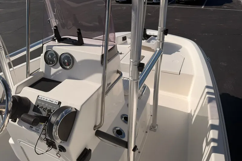 Slide: The Image of 2019 Bayliner Element F18 boat console with steering wheel and gauges. - 10