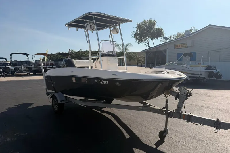 Slide: The Image of 2019 Bayliner Element F18 boat on trailer in sunny outdoor setting. - 4