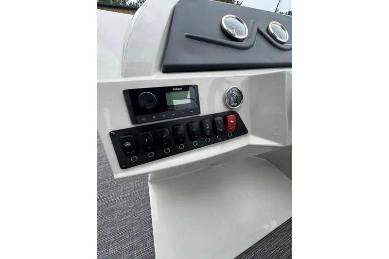 Slide: The Image of 2023 Crest 220 Classic LX dashboard with control panel and gauges. - 9