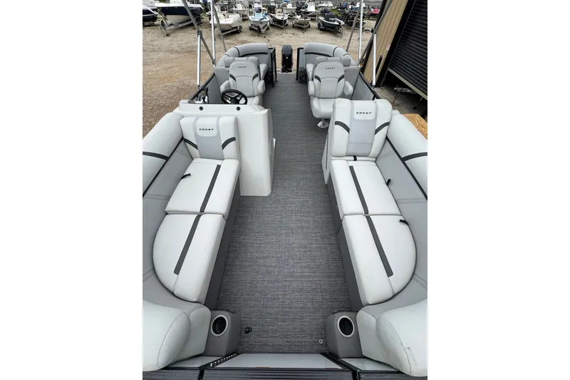 Slide: The Image of 2023 Crest 220 Classic LX pontoon boat interior with spacious seating and modern design. - 12