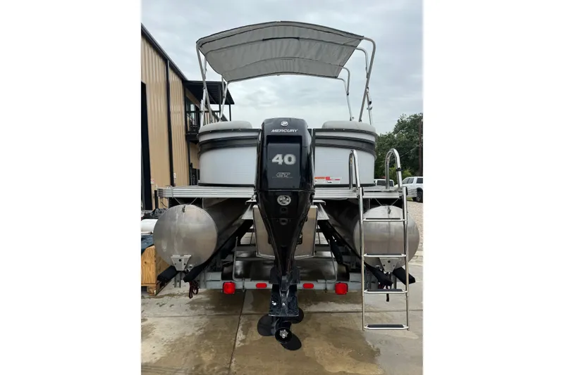Slide: The Image of 2023 Crest 220 Classic LX pontoon boat with Mercury 40 HP engine and ladder. - 17
