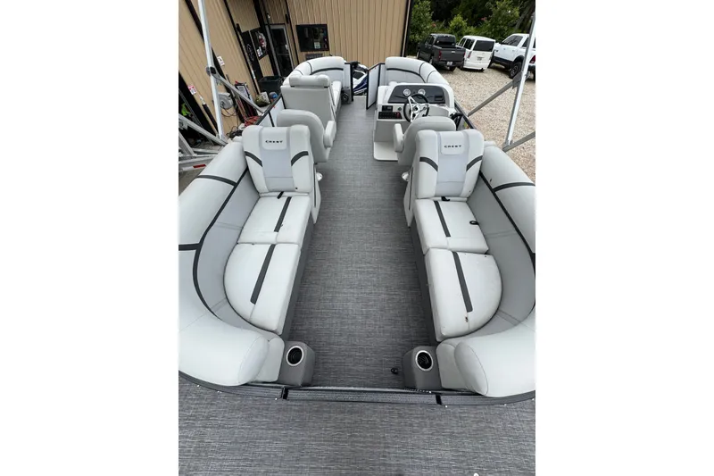 Slide: The Image of 2023 Crest 220 Classic LX pontoon boat with spacious seating and modern design. - 4