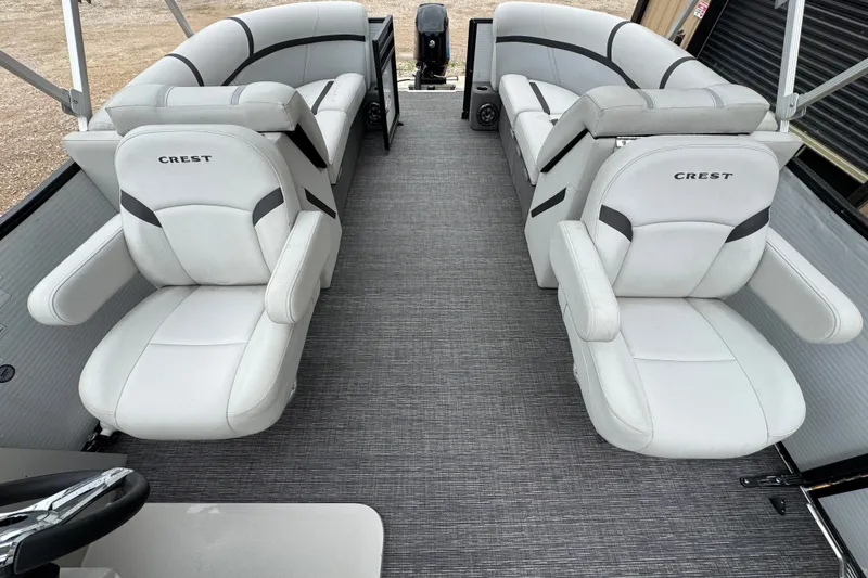 Slide: The Image of 2023 Crest 220 Classic LX pontoon boat interior with plush seating and modern design. - 8