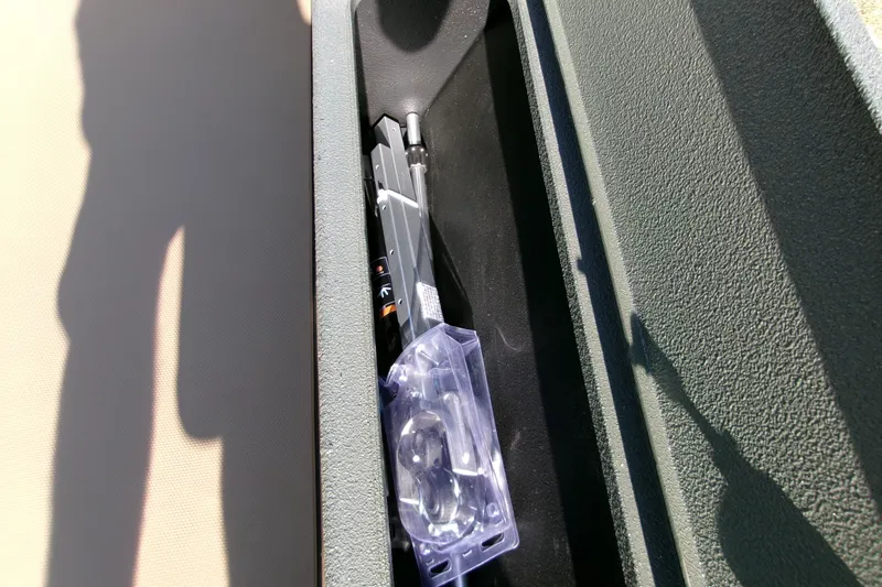 Slide: The Image of Storage compartment of 2027 Xpress X18DB boat with tools and accessories. - 6