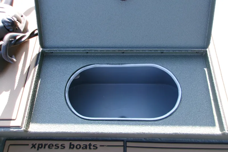 Slide: The Image of Open storage compartment on 2027 Xpress X18DB boat. - 11