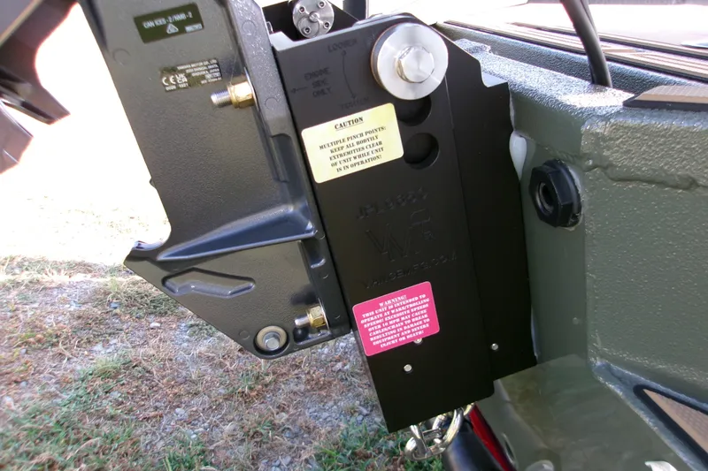 Slide: The Image of Close-up of Xpress X18DB 2027 boat engine mount with caution labels. - 15