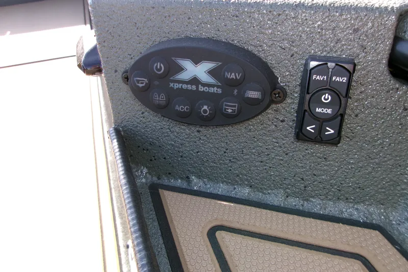 Slide: The Image of Control panel of 2027 Xpress X18DB boat with navigation and mode buttons. - 19