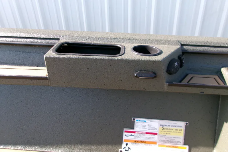 Slide: The Image of Interior of 2027 Xpress X18DB boat with cup holders and capacity warning labels. - 10