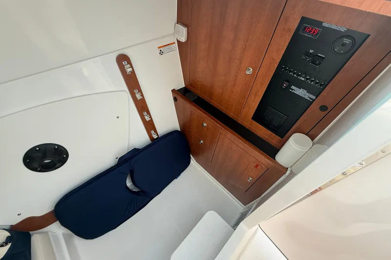 Slide: The Image of Interior of 2026 Pursuit DC 326 Dual Console with control panel and seating. - 15
