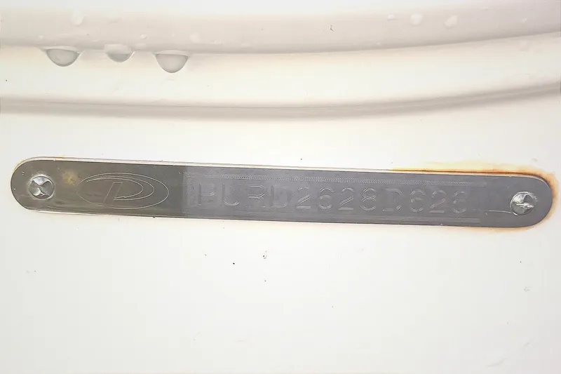 Slide: The Image of 2026 Pursuit DC 326 Dual Console boat hull with water droplets. - 20