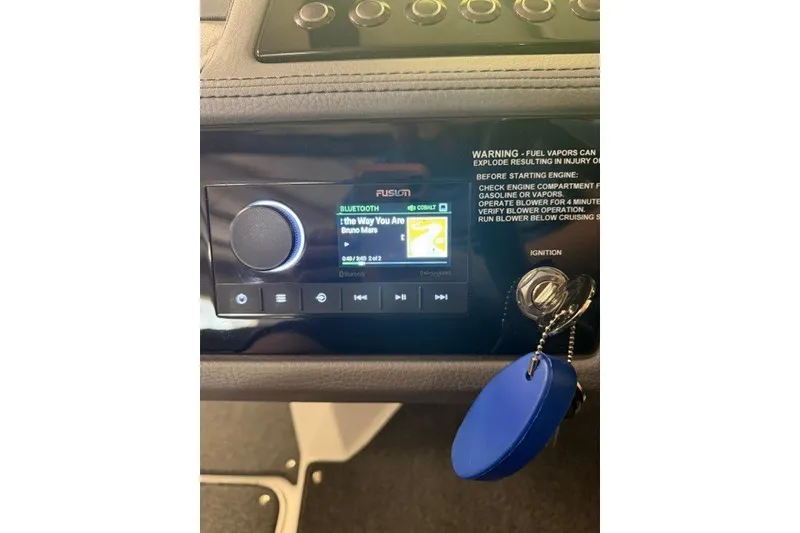 Slide: The Image of 2023 Cobalt R4 Surf dashboard with Fusion stereo displaying song by Bruno Mars. - 12