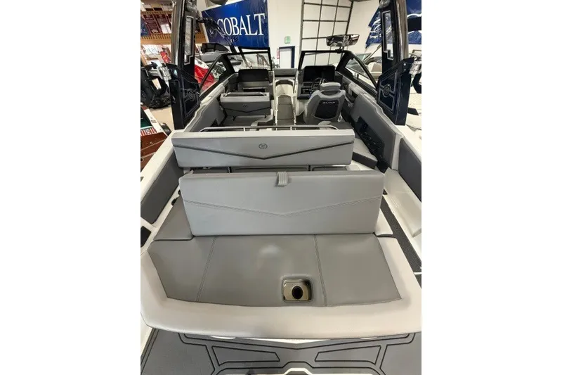 Slide: The Image of 2023 Cobalt R4 Surf boat interior with gray seating and modern design. - 24