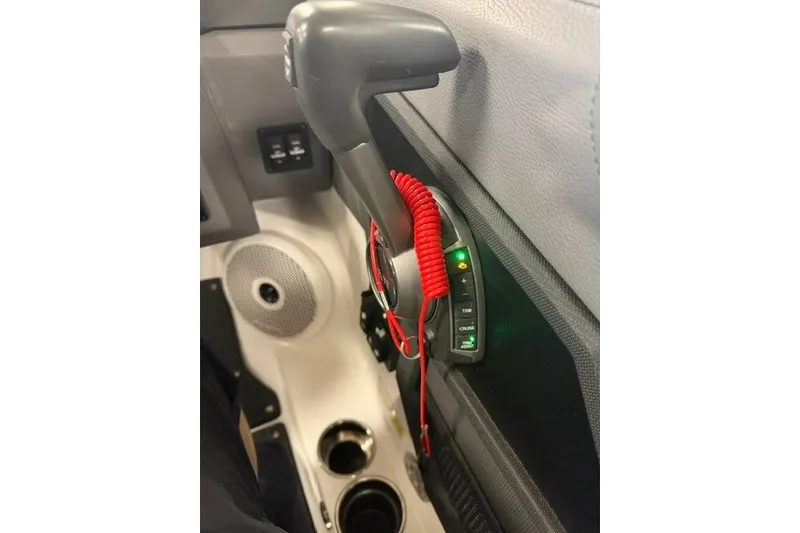 Slide: The Image of Interior of 2023 Cobalt R4 Surf boat with control panel and speaker. - 17