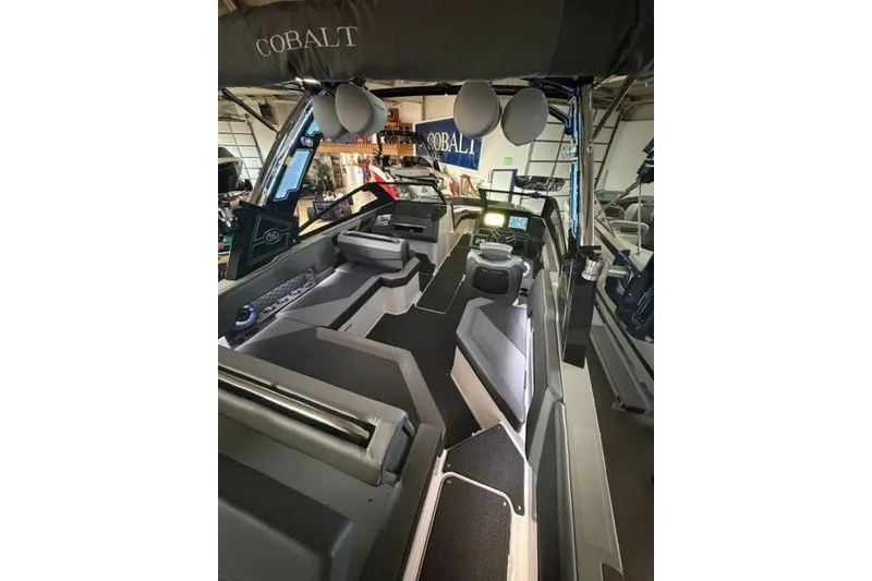 Slide: The Image of 2023 Cobalt R4 Surf boat interior with modern seating and advanced dashboard. - 5