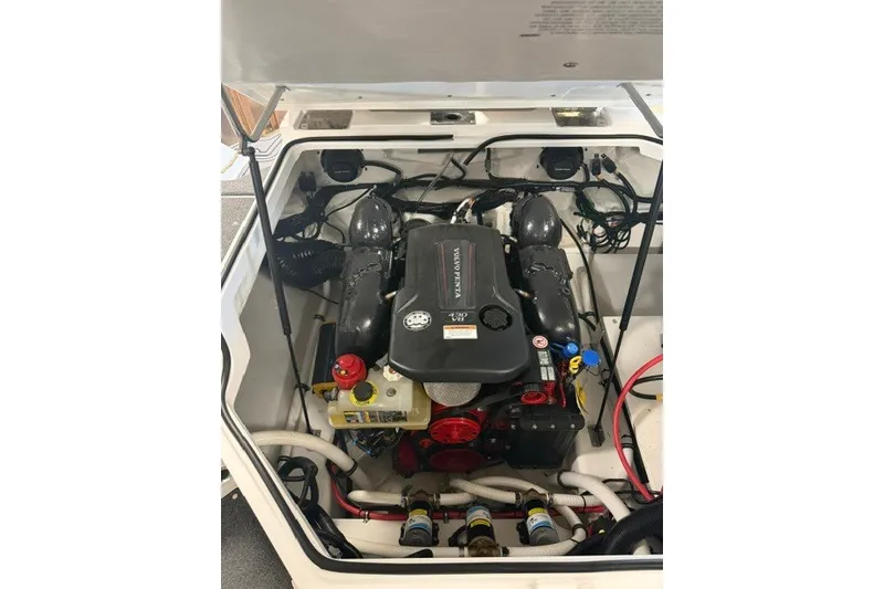Slide: The Image of Engine compartment of 2023 Cobalt R4 Surf boat, showcasing detailed mechanical components. - 4