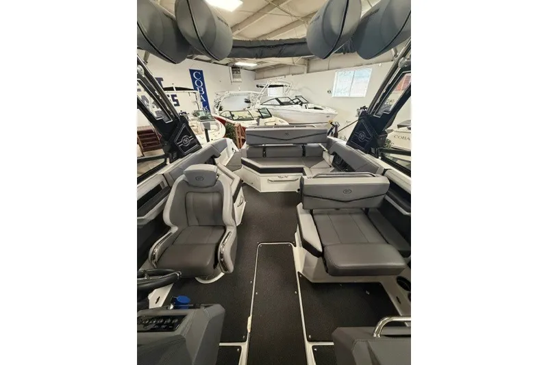 Slide: The Image of 2023 Cobalt R4 Surf boat interior with sleek gray seating and modern design. - 22