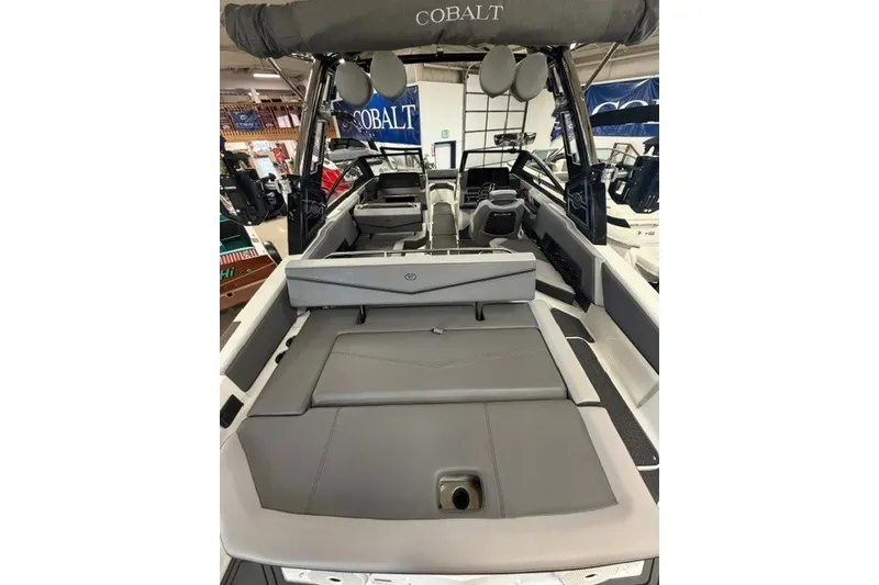 Slide: The Image of 2023 Cobalt R4 Surf boat interior with gray seating and modern design. - 25
