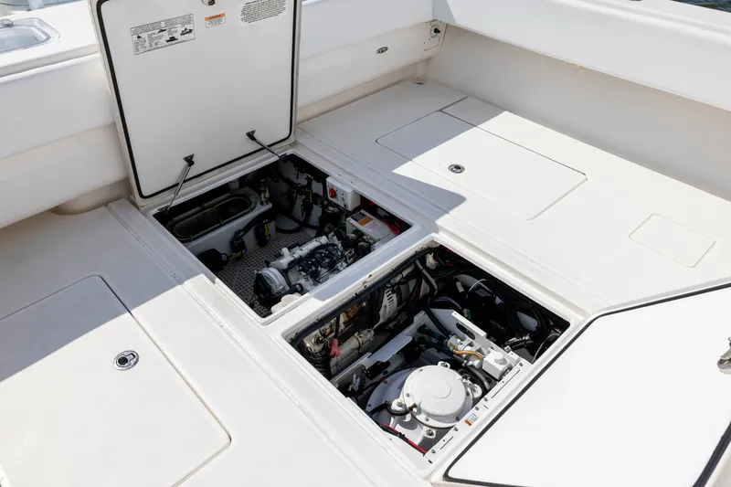 Slide: The Image of Engine compartment of 2020 Contender 44 Fisharound boat, showcasing mechanical components. - 40