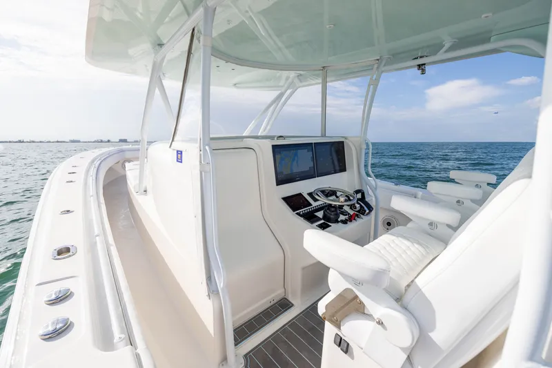 Slide: The Image of 2020 Contender 44 Fisharound boat interior with helm, ocean view. - 27