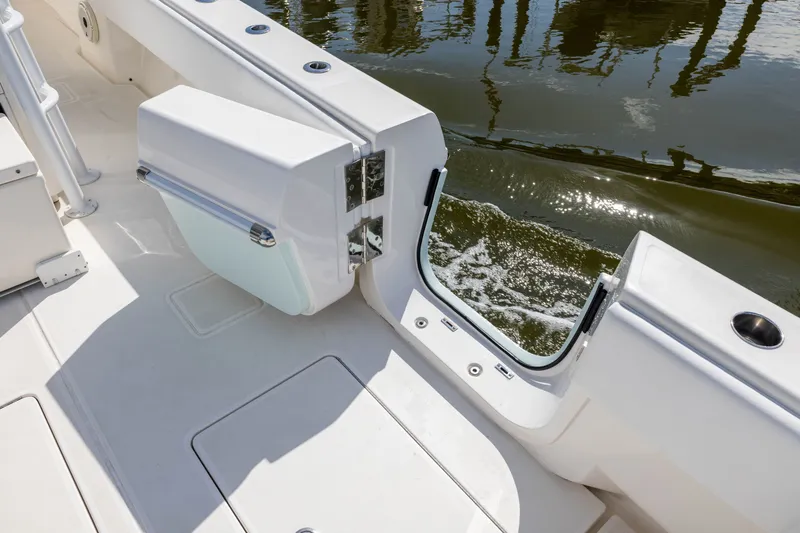 Slide: The Image of 2020 Contender 44 Fisharound boat deck with open transom door, water view. - 39