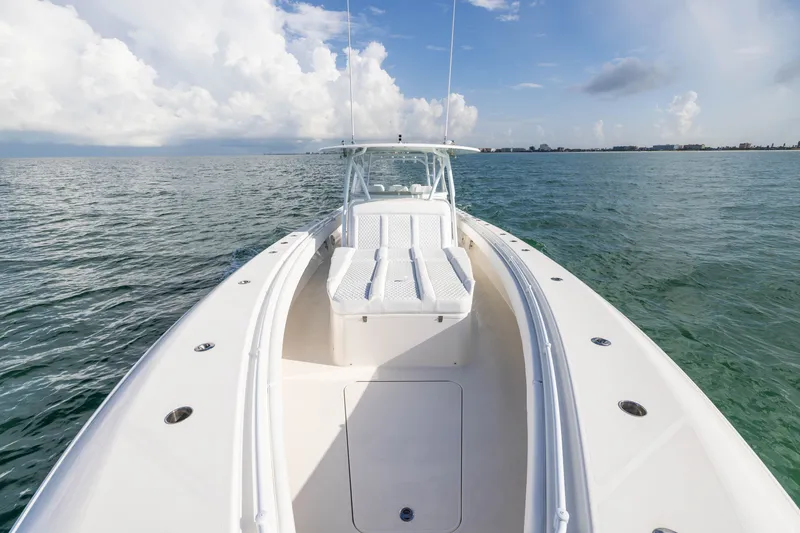 Slide: The Image of 2020 Contender 44 Fisharound boat on open water under a partly cloudy sky. - 17