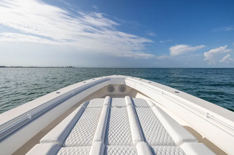 Slide: The Image of 2020 Contender 44 Fisharound boat on open sea under clear blue sky. - 14
