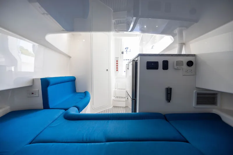 Slide: The Image of Interior of 2020 Contender 44 Fisharound boat with blue seating and modern amenities. - 47