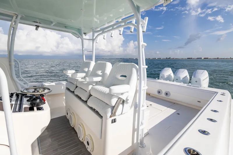 Slide: The Image of 2020 Contender 44 Fisharound boat with seating and ocean view. - 23
