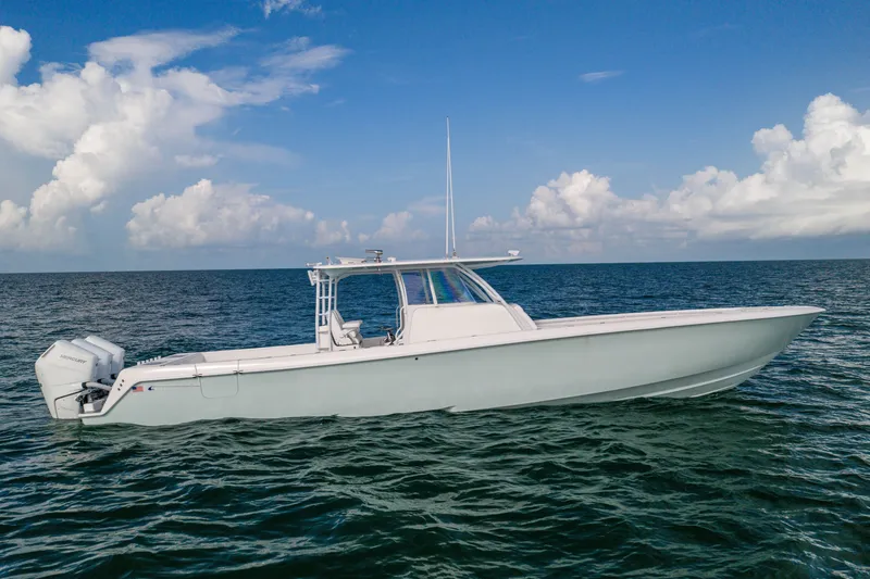 The Image of 2020 Contender 44 Fisharound boat on open sea under blue sky. - 1
