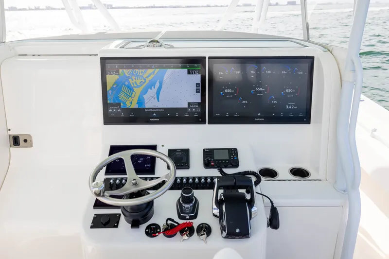 Slide: The Image of Helm of 2020 Contender 44 Fisharound with dual Garmin displays and controls. - 29