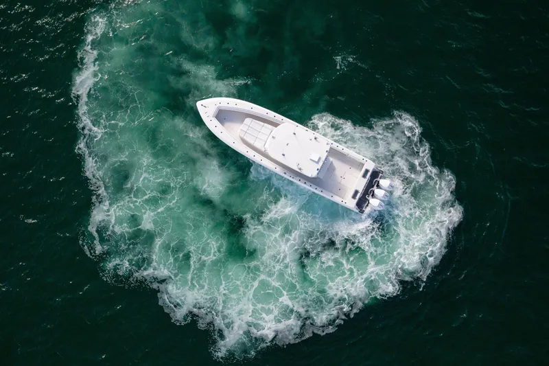 Slide: The Image of Aerial view of 2020 Contender 44 Fisharound boat navigating ocean waters. - 6