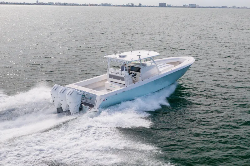 Slide: The Image of 2020 Contender 44 Fisharound boat cruising on open water. - 11