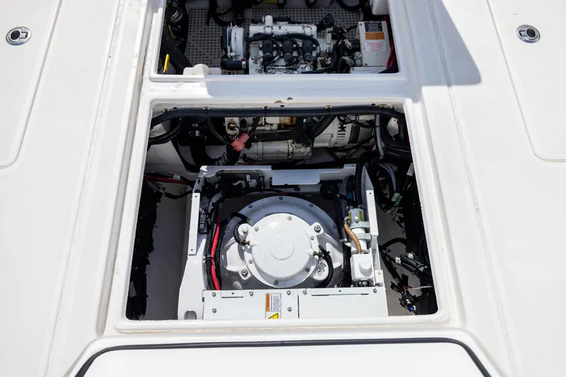 Slide: The Image of Engine compartment of a 2020 Contender 44 Fisharound boat, showcasing mechanical components. - 42