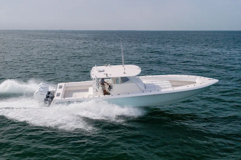 Slide: The Image of 2020 Contender 44 Fisharound boat cruising on open water. - 8