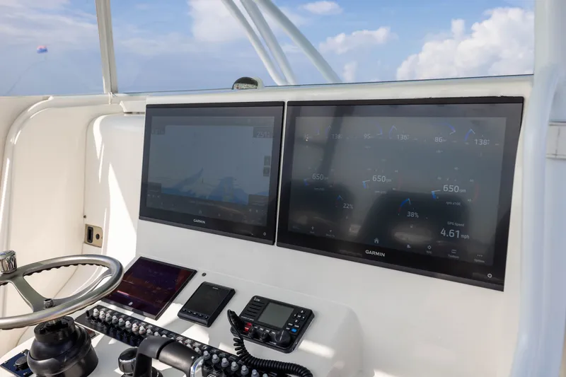 Slide: The Image of Dashboard of 2020 Contender 44 Fisharound with Garmin navigation displays. - 31
